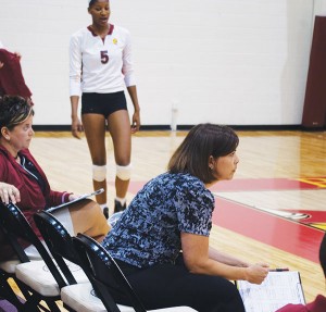 Coach Tia Brandel-Wilhelm <span class='credit'>Photo By: Kristyn Sonnenberg | Photo Editor</span><span class='description'>Coach Tia Brandel-Wilhelm pays close attention as the Ferris women’s volleyball team fights for victory at a recent match. She began coaching volleyball in 1993 and has since led her teams to 393 victories.</span>