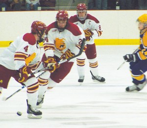 Bulldogs on Ice <span class='credit'>Photo By: Kristyn Sonnenberg | Photo Editor</span><span class='description'>Bulldogs on Ice: Chad Billins (#4), Zach Redmond (#24), and Cody Chupp (#8) press toward the goal at Sundays exhibition game against Wilfred Laurier. The Bulldogs lost 3-1, with Billins, a sophomore, scoring the single goal. The season officially begins next weekend in Buffalo, New York against the Canisius Golden Griffins.</span>