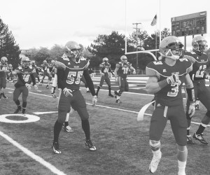 Amping Up <span class='credit'>Photo By: Kate Dupon | Photographer</span><span class='description'>Amping Up: The team warms up before the second half of the homecoming game this Saturday against Indianapolis. </span>
